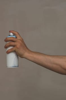 Spray can in hand. painting process