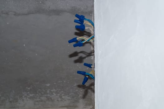 Unfinished socket with electrical wires and connectors. repair process