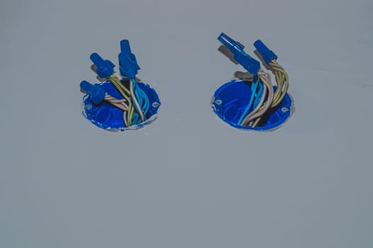 Unfinished electrical socket with electrical wires and connectors. renovation process