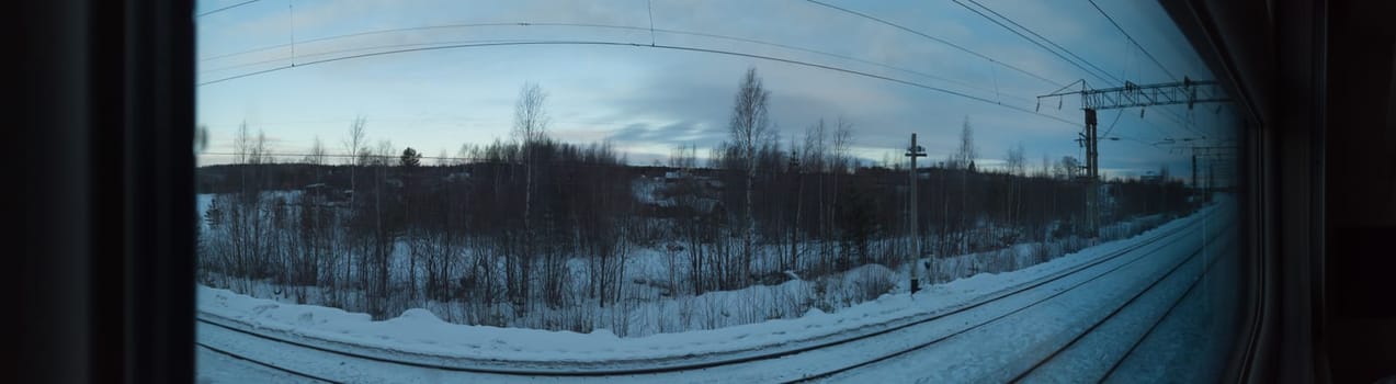 View from the window of the passenger train. winter weather