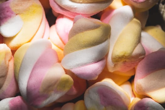 Twisted marshmallow close up. handful of chewy candy
