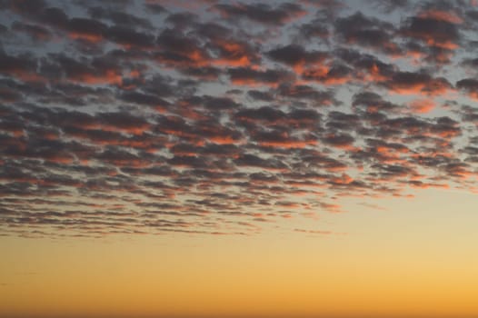 Golden sunset cloudscape. sky with clouds at the evening