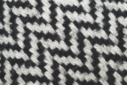 Wool carpet texture close up. knitted rug background