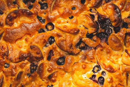 Apple pie close up. charlotte with berries. baking background