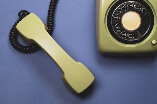 Phone with handset. vintage green telephone with phone receiver. office background. old communication technology. copy space