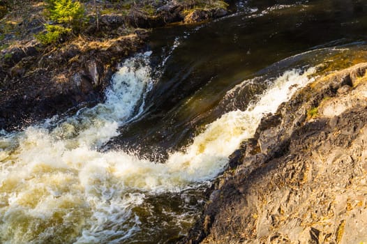 Waterfall nature background. rushing stream water. rocky flowing river