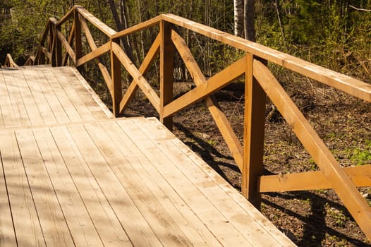 Wooden staircase in the park. stairway made from the wood in the forest