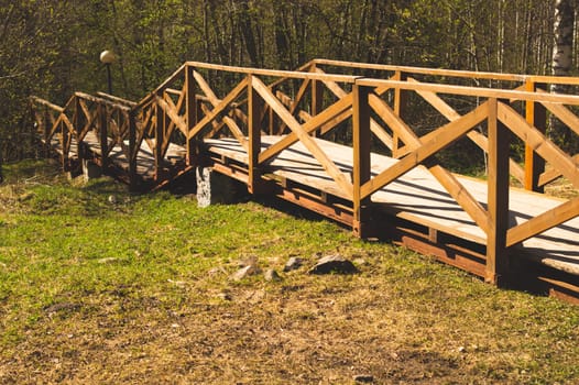 Wooden staircase in the park. stairway made from the wood in the forest