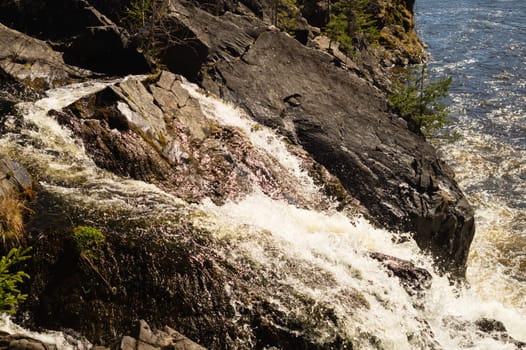 Waterfall nature background. rushing stream water. rocky flowing river
