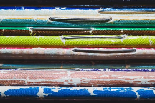 Stack of old magazines. pile of retro newspapers. vintage journals lie on top of each other. colorful background from the printed publications