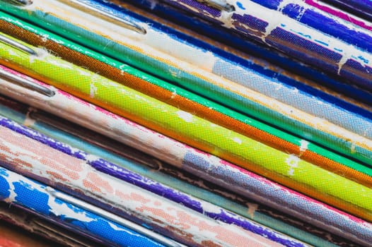 Stack of old magazines. pile of retro newspapers. vintage journals lie on top of each other. colorful background from the printed publications