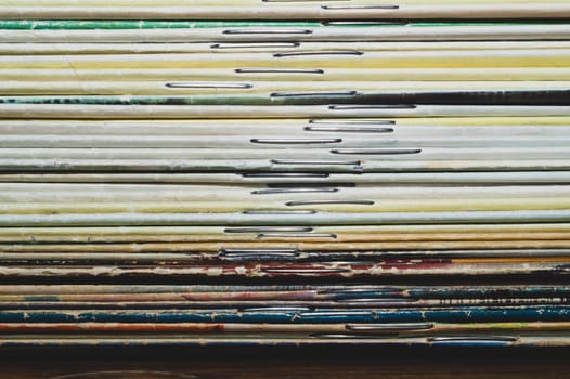 Stack of old magazines. pile of retro newspapers. vintage journals lie on top of each other