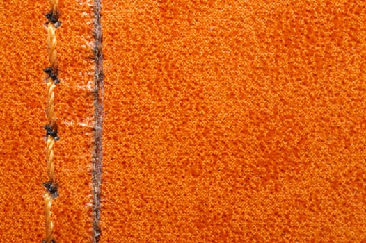 Brown leather texture with a linear stitch. material with seam