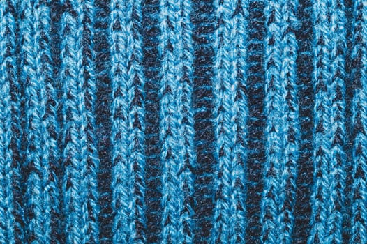 Blue fabric texture. knitted textile background. woven material close up. knitting from wool yarn