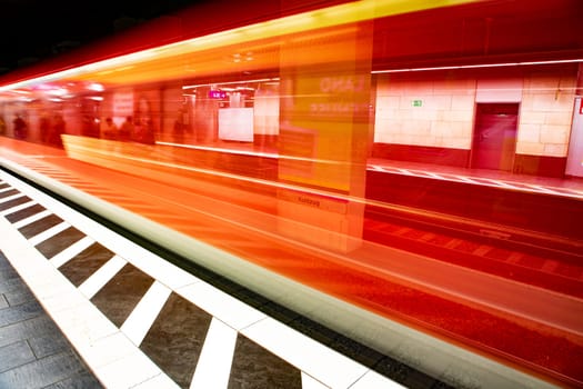 blurred motion of metro train entering the train station in Frankfurt