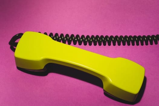 Telephone handset. phone receiver on red background. old communication technology. copy space