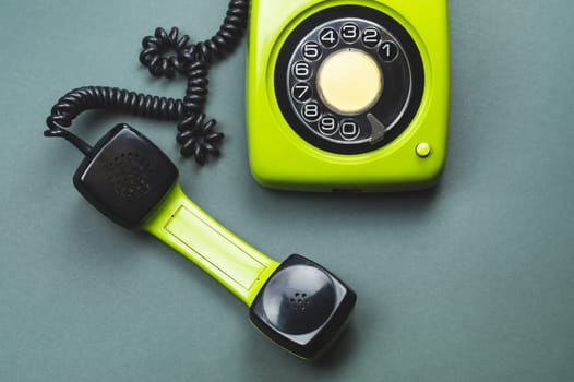 Classic phone with handset. vintage green telephone with phone receiver. office background. old communication technology. copy space