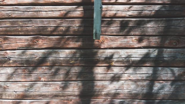 Wooden wall of log cabin. wood background. square timber. facade of wooden house