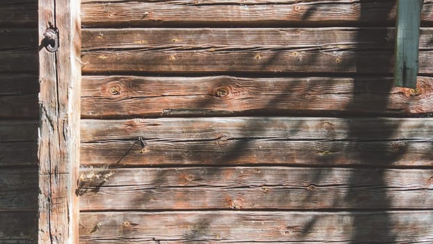 Wooden wall of log cabin. wood background. square timber. facade of wooden house
