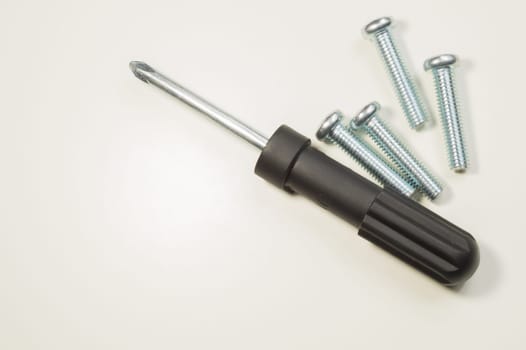 Steel screw on a white background. working tools