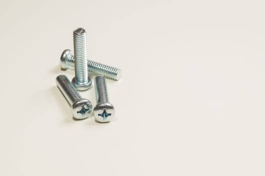 Steel screw on a white background. working tools