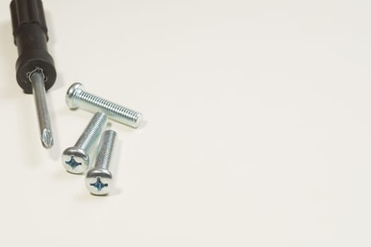 Steel screw on a white background. working tools