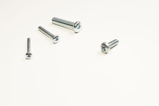 Steel screw on a white background. working tools