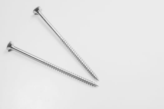 Steel screw on a white background. working tools