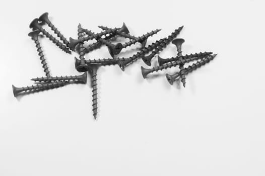 Steel screw on a white background. working tools