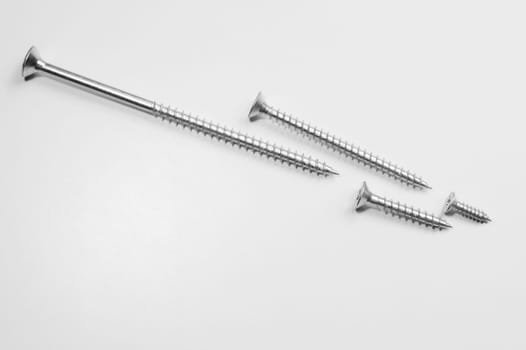 Steel screw on a white background. working tools