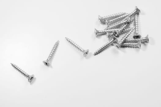 Steel screw on a white background. working tools