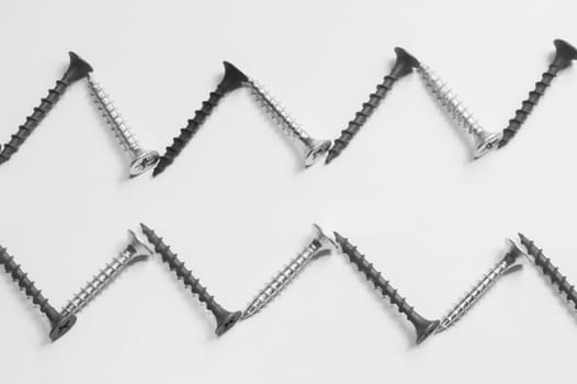 Steel screw on a white background. working tools