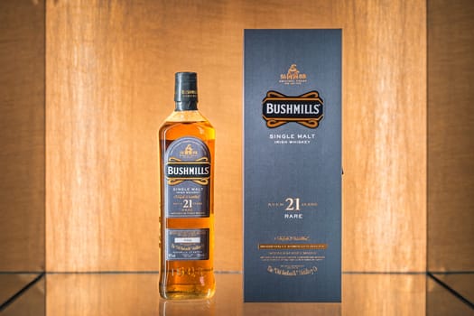Bushmills, Northern Ireland, Aug 2019 Selective focus on rare, aged 21 years Bushmills whiskey with a box on illuminated display in distillery shop
