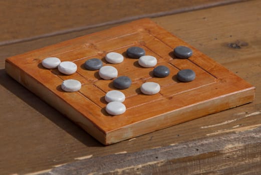 Reconstruction of roman board game Nine mens morris or mill game. Private recreational activity of ancient romans