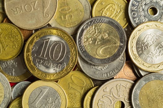 Coins of the different countries. a lot of metal coins of different denominations and various countries. finance background