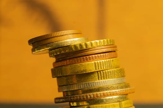 Unstable stack of different coins macro