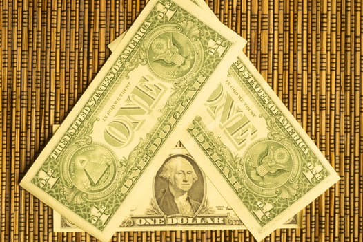 Dollars on a wooden bamboo background. money on the table. finance background