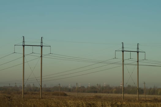 Power line posts. high voltage tower with the sky. industrial background