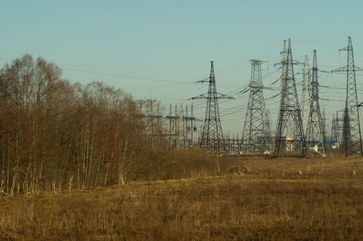 Power line posts. high voltage tower with the sky. industrial background