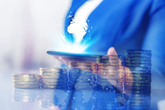 Double exposure, Technology network and online banking and internet banking and networking people concept, Business women with laptop, phone, cellphone, tablet, smartphone mobile, and coin money on business office table