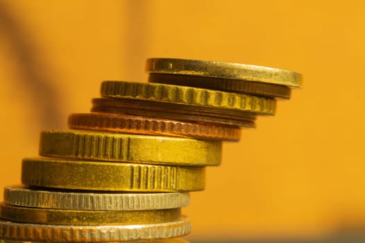 Unstable stack of different coins macro