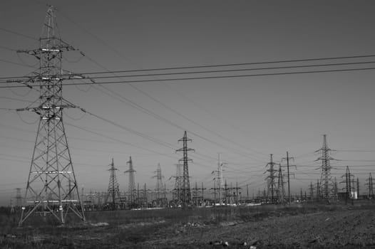 Power line posts. high voltage tower with the sky. industrial background