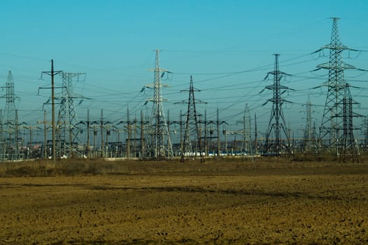 Power line posts. high voltage tower with the sky. industrial background