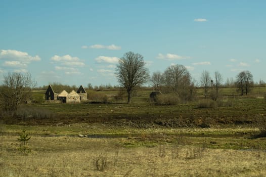 Old abandoned building in the forest. ruined cowshed. rural landscape