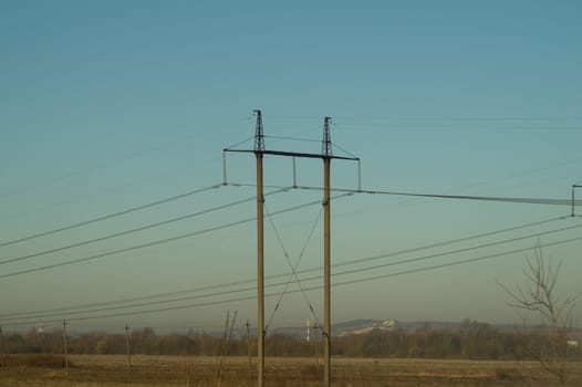 Power line posts. high voltage tower with the sky. industrial background