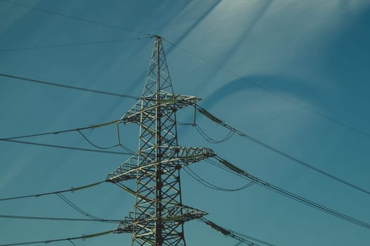 Power line post. high voltage tower with the sky. industrial background