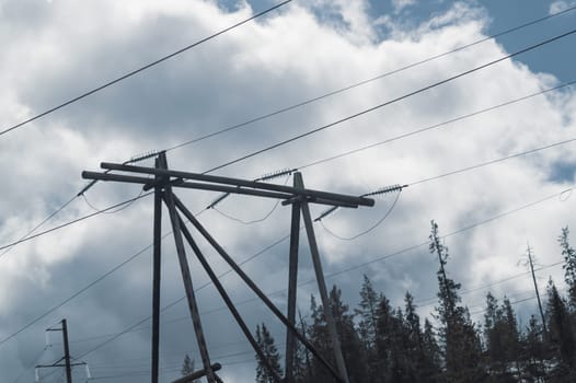 Power line post. high voltage tower with the sky. industrial background