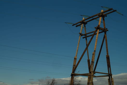 Power line post. high voltage tower with the sky. industrial background