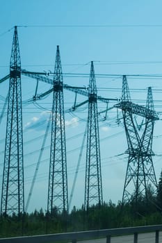 Power line posts. high voltage tower with the sky. industrial background