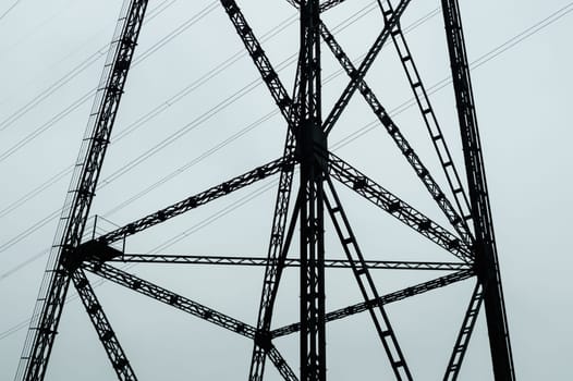 Detail of power line post. high voltage tower with the sky. industrial background